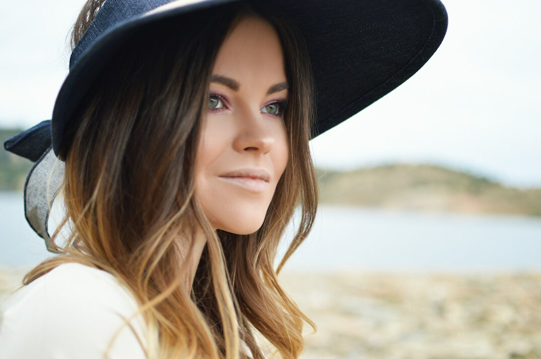 Portrait of a young woman with long hair smiling