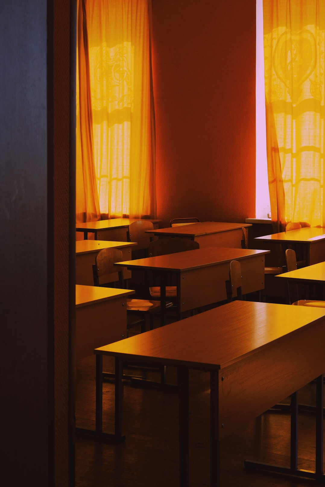 Adult learners attending a lecture in a bright classroom